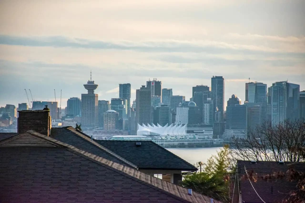 Downtown Vancouver skyline with Harbour Centre and Canada Place across the water — executive coaching in Vancouver, British Columbia, Canada